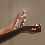 Person spraying My Om World AROMATIC BODY MIST