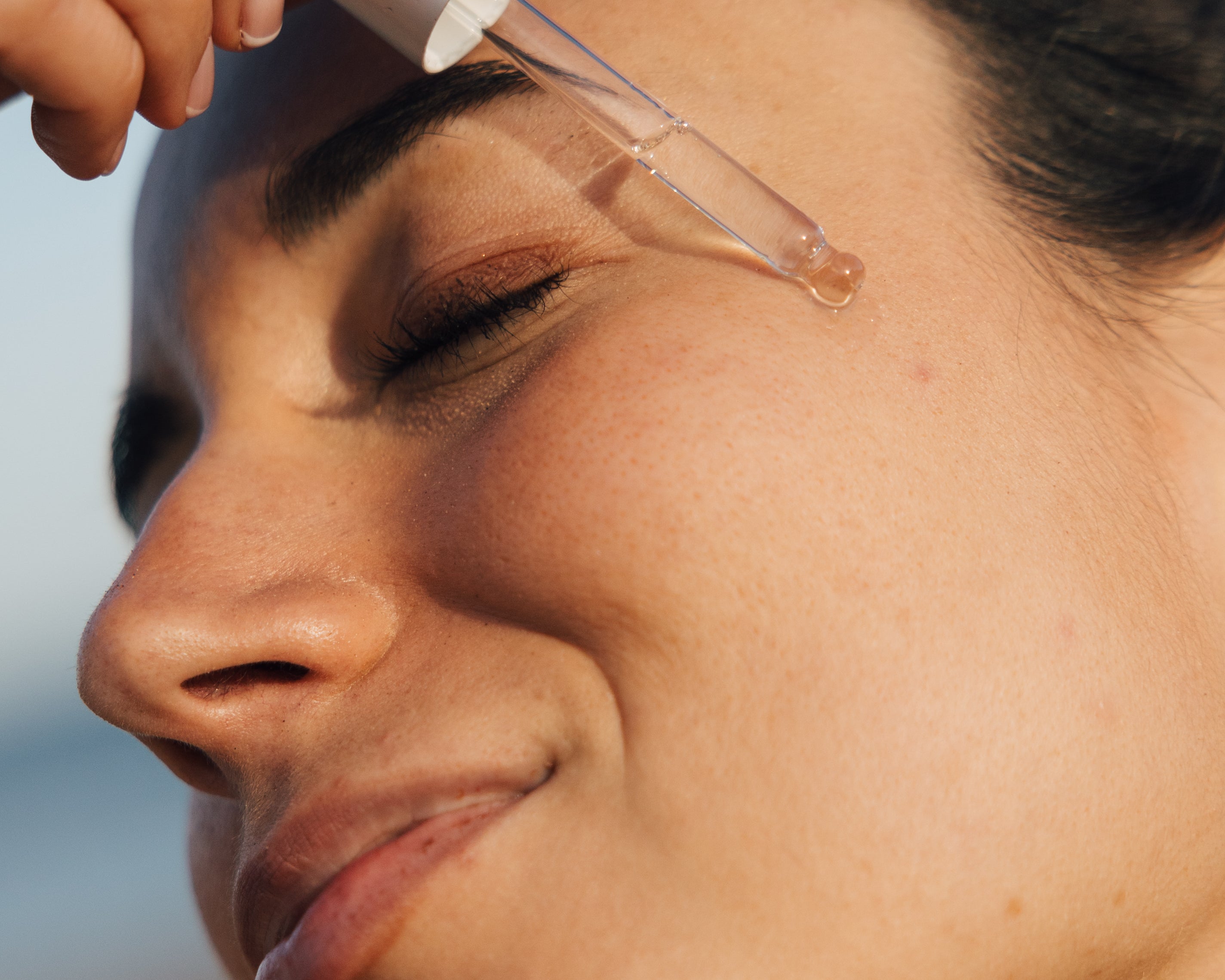 Zenicure REJUVENATING FACIAL OIL dropper on face