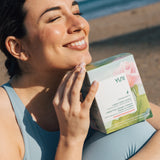 Woman smiling with Rose Cucumber Box 