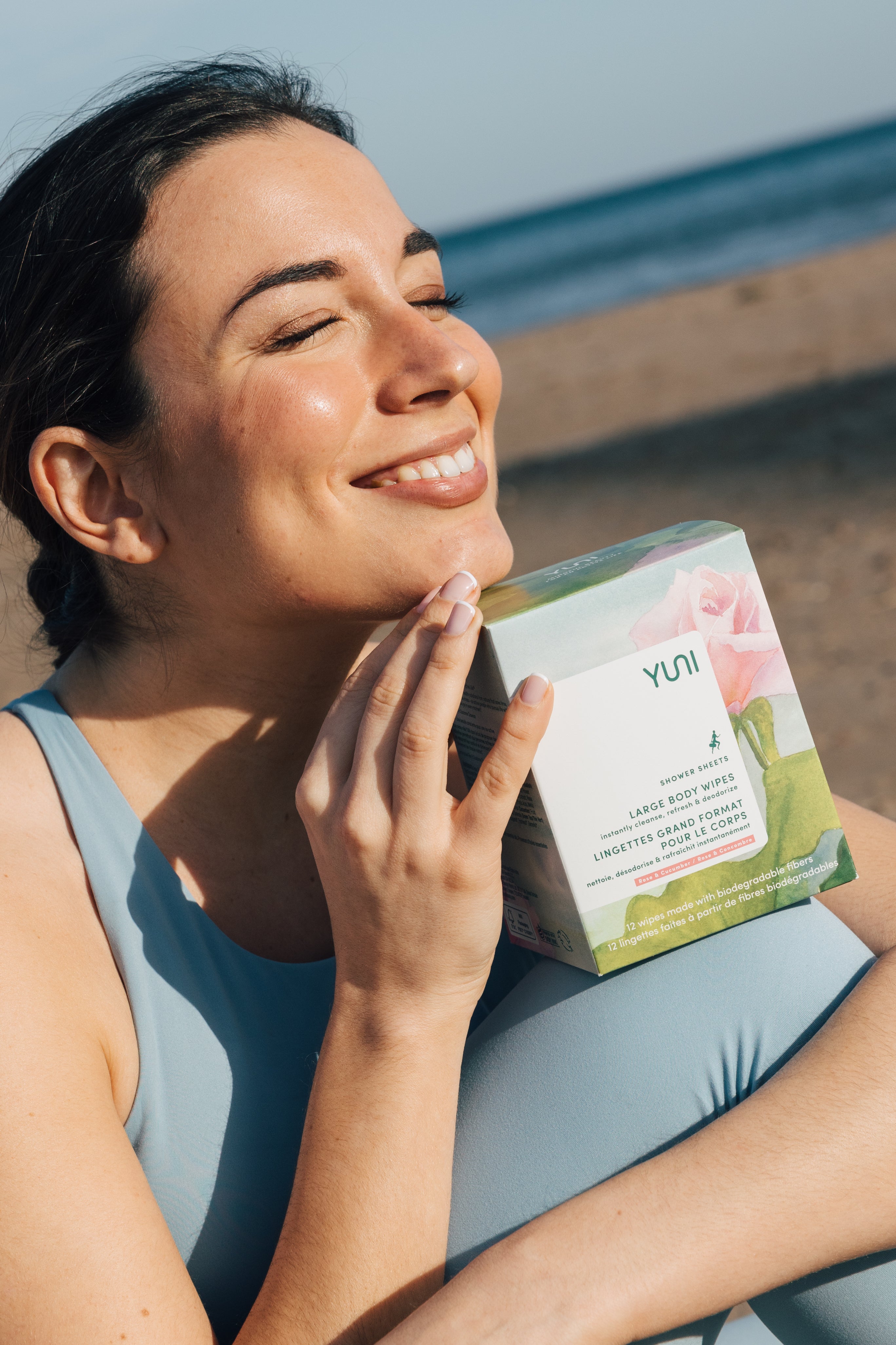 Woman smiling with Rose Cucumber Box 