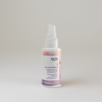 YUNI perfume bottle on a light gray background